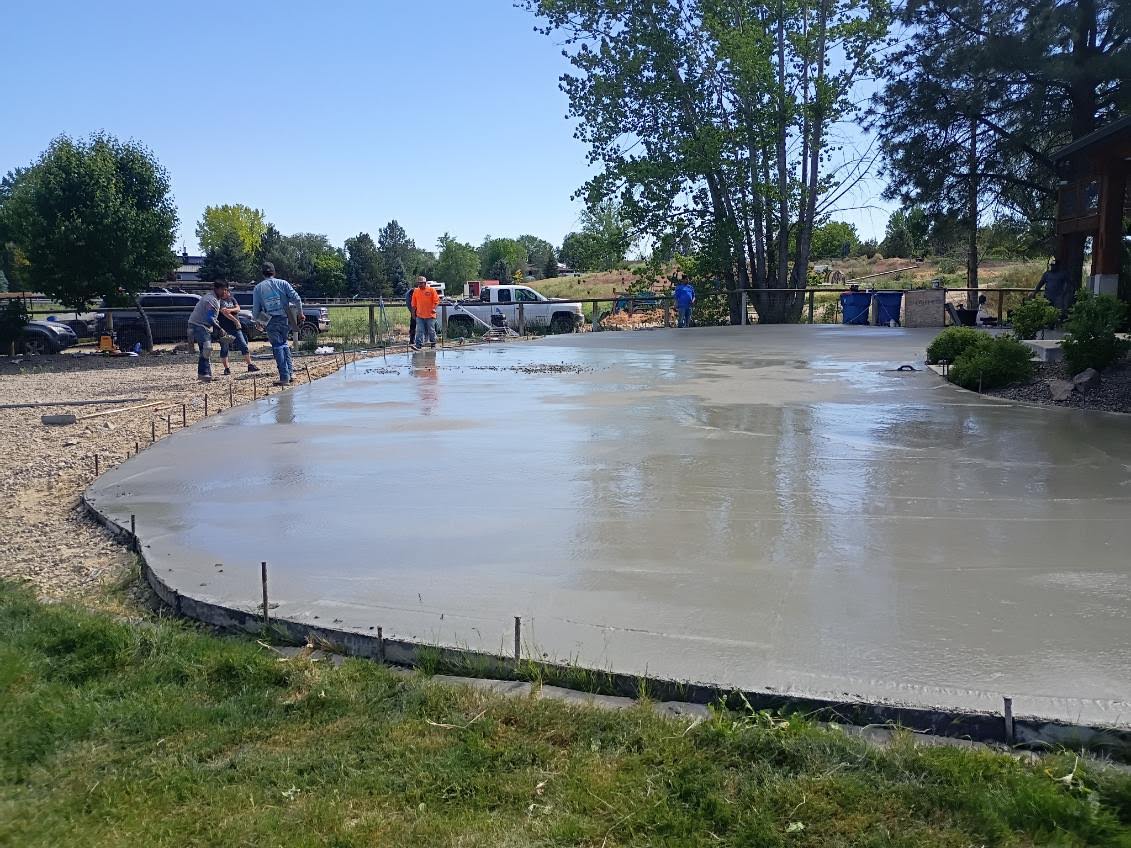 Concrete driveway crew finishing work in Idaho